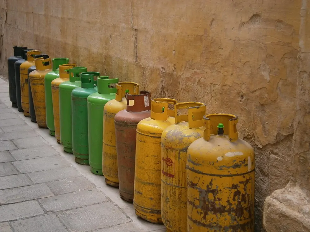 Row of LPG gas cylinders and accessories