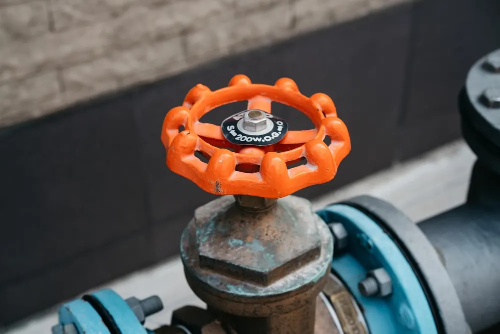 Orange valve wheel on a gas pipeline